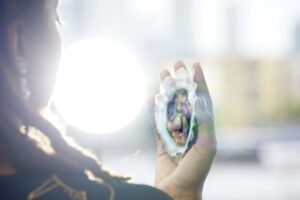 Individual holding a clam shell